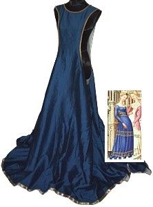 a long, sleeveless blue dress displayed on a mannequin with a historical painting of two women in similar long dresses to the right.