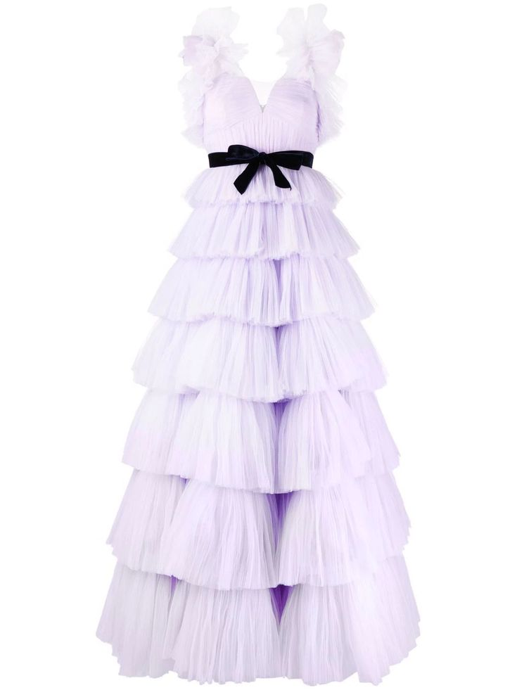 a floorlength dress in a light lilac color is prominently displayed against a plain white background. the dress features a sleeveless design with ruffled detailing around the arm openings. it has a fitted bodice and a vneckline. the waist is accentuated with a black bow. the skirt is made up of multiple tiers of ruffles, creating a full and voluminous effect. the fabric appears to be tulle, adding a delicate and ethereal quality to the gown.