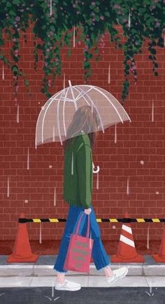 the image shows a girl walking on a sidewalk beside a red brick wall. it's raining and she has a clear umbrella over her head. the girl is wearing blue jeans, a green jacket, and white shoes, and carrying a red bag. there are orange and white traffic cones placed along the edge of the sidewalk.