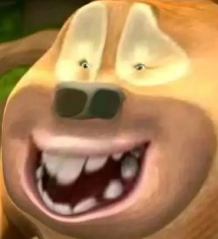 closeup image of a cartoon dog's face. the dog is smiling widely, showing its teeth and tongue. it has brown fur, a large black nose, and its eyes are squinted closed in a happy expression. the background is blurry green, suggesting an outdoor setting.