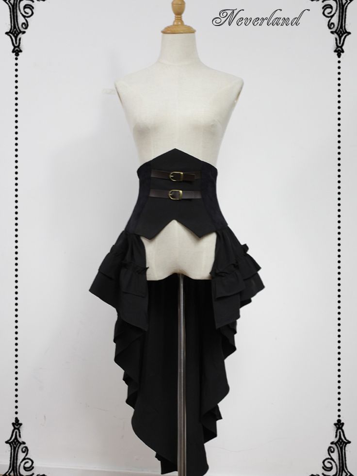 a black gothic lolita steampunk dress is displayed on a headless mannequin against a white background. the dress features a fitted bodice with a pointed hem and two buckled straps. the skirt is asymmetrical with multiple layers of ruffles and a long train in the back. the mannequin is made of a light beige fabric and has a wooden neck. the overall lighting is soft and artificial, highlighting the details of the dress.