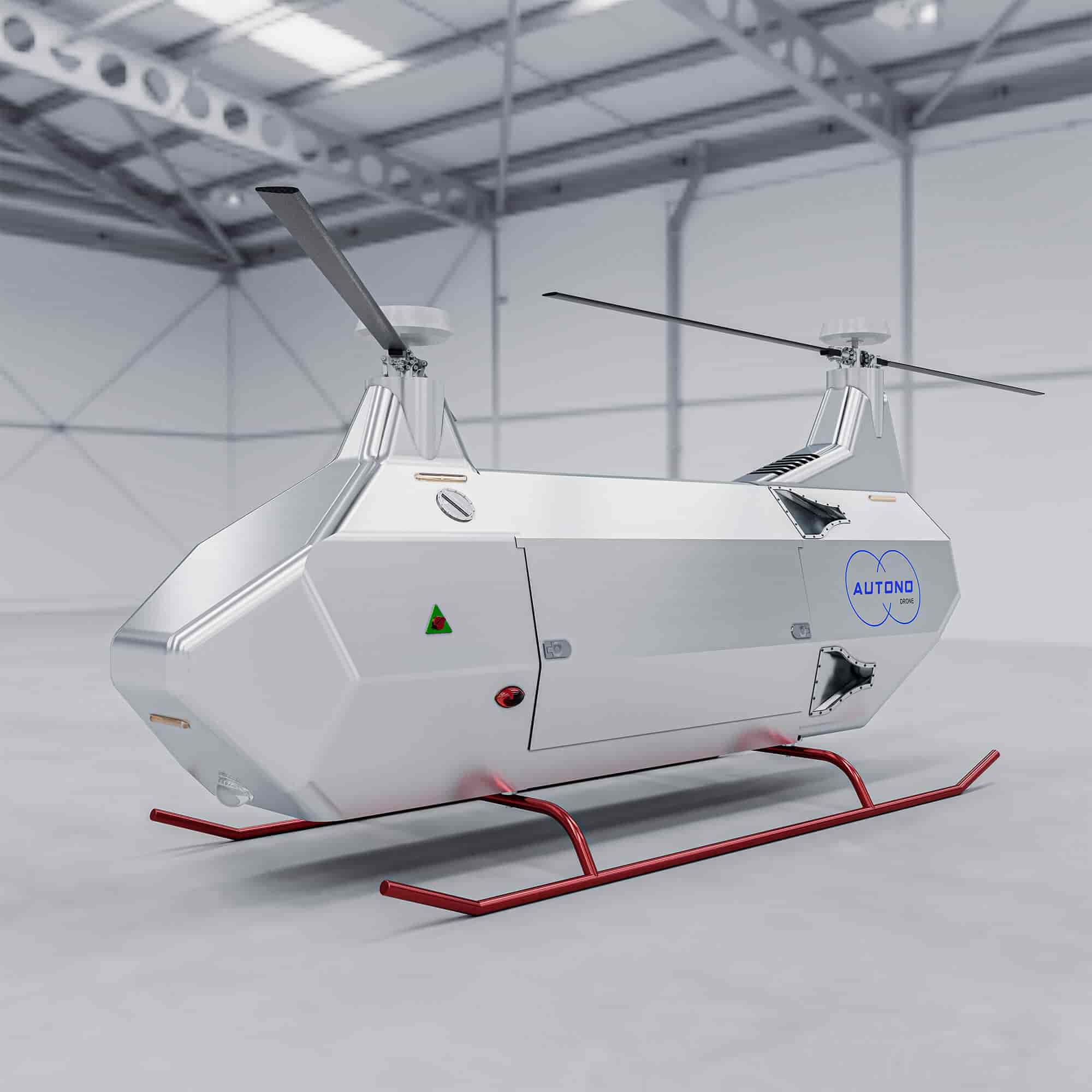 a futuristic silver drone helicopter, with red landing gear, is parked in a hangar. the drone has "autono" branding on the side. the drone is in a warehouse with white walls and metal beams. the helicopter has a streamlined design and is made of what appears to be metallic materials. the drone has a sleek design, which is indicative of high tech and innovation. the helicopter is a symbol of future transportation and the advancement of drone technology.