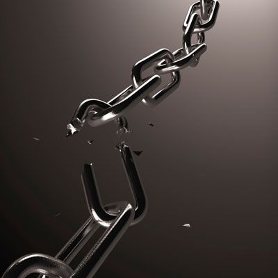 the image shows a thick metallic chain that is broken. it is shown against a gray background. the image is symbolic of breaking free.