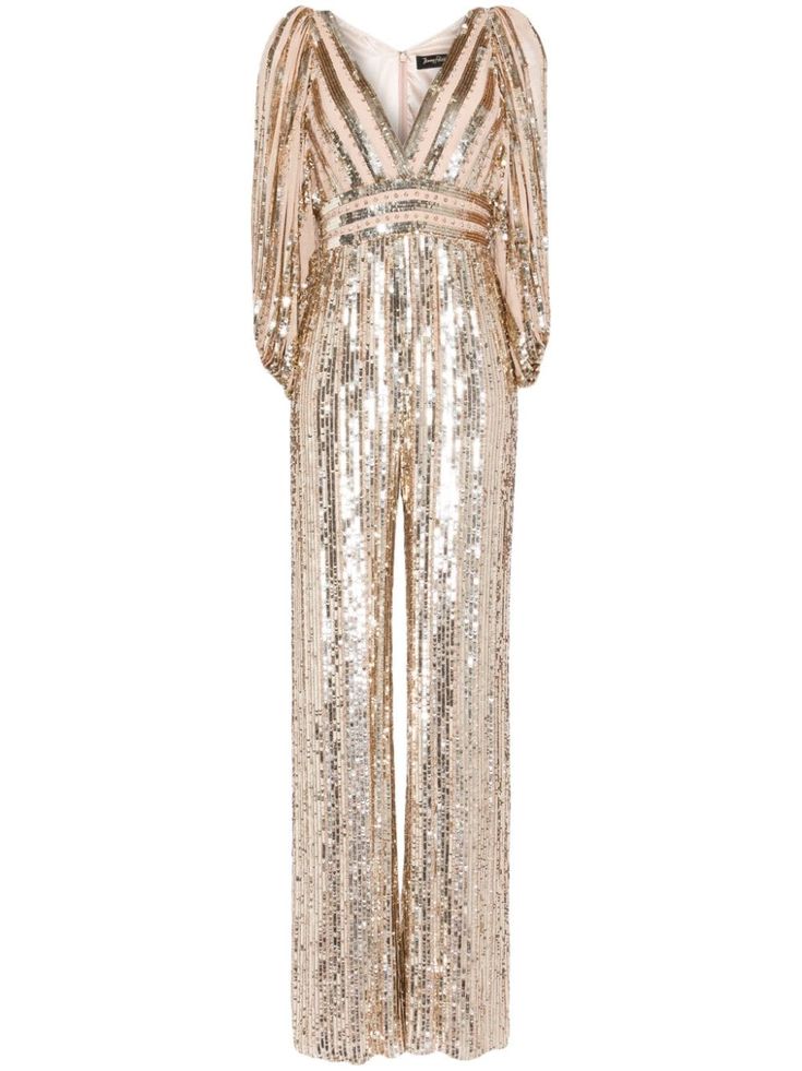 a gold sequin jumpsuit with a vneck and long sleeves. the jumpsuit has a relaxed fit and is perfect for a night out.