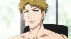 a closeup of an anime character. the character is a man with short, light brown hair and brown eyes. he is shown from the chest up and is not wearing a shirt. he has a neutral expression on his face. the background is out of focus and appears to be an indoor setting.