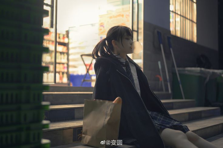 a young asian schoolgirl in a dark blazer, pleated skirt, and tie sits on steps outside a convenience store at night. she is blowing a bubble of gum. the atmosphere is dark and moody. the image is a portraitstyle shot, with the girl in focus and the background blurred.