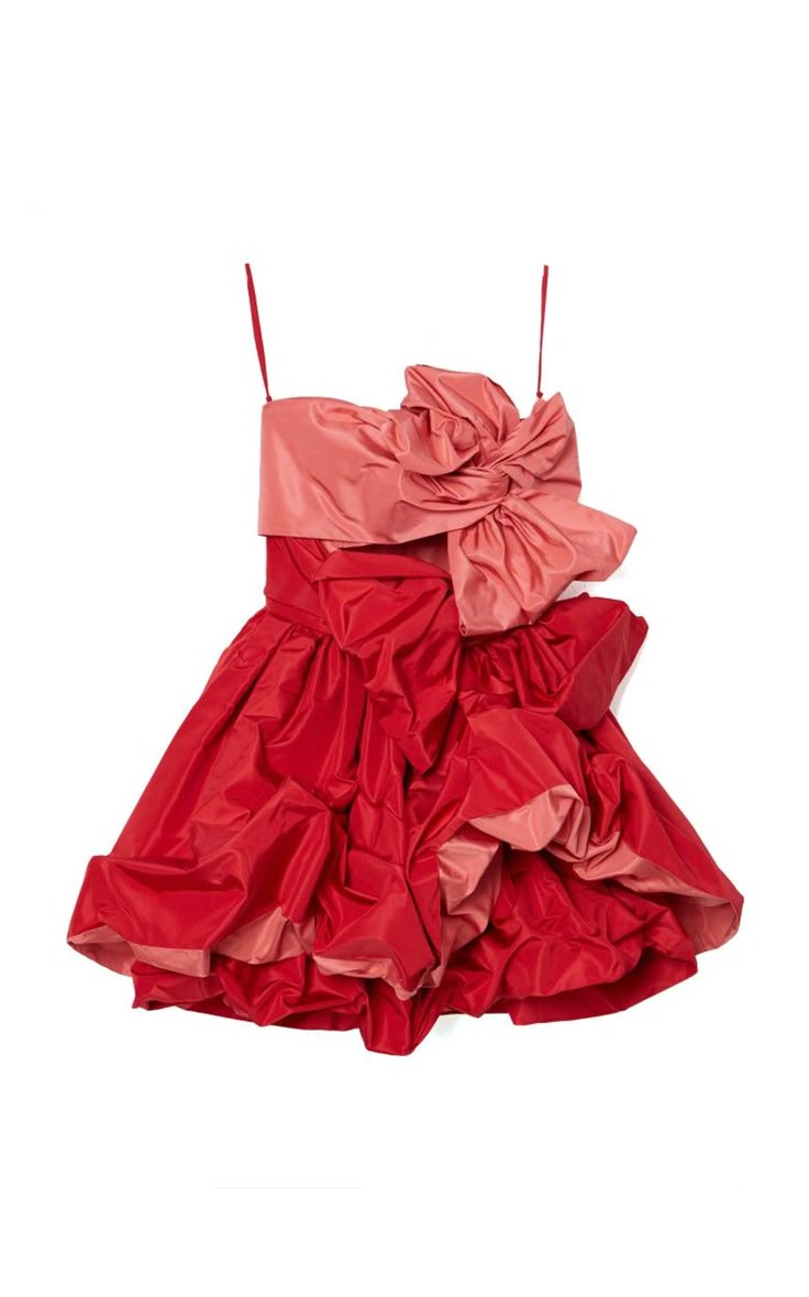 a strapless, short, party dress, mostly red, with a large pink bow at the top left. the dress is made of taffeta with lots of crumpled fabric around the body.