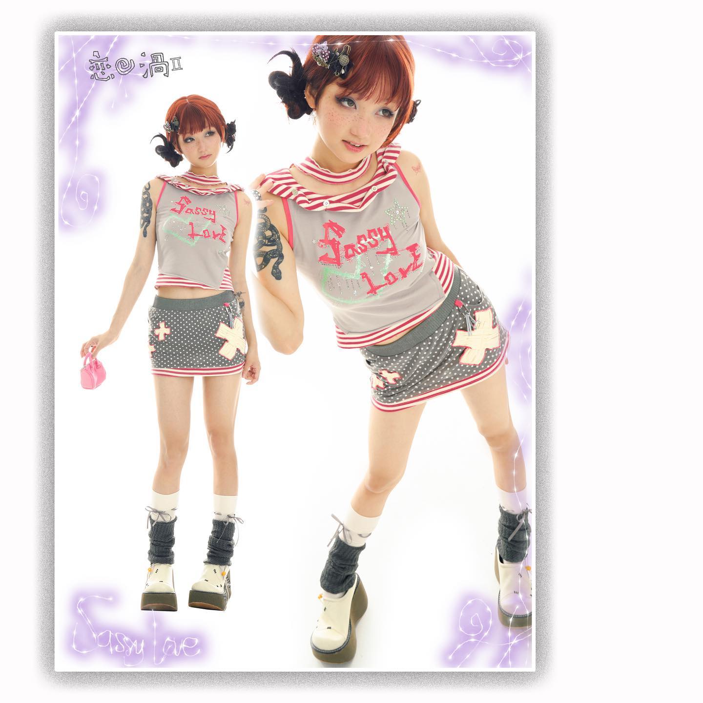 the image showcases two photos of a young asian woman modeling a distinct style of clothing.  the style blends elements of lolita, harajuku, and punk fashion.  she's wearing a grey mini skirt with a red cross pattern, paired with a grey sleeveless top featuring pink "sassy love" text.  the top has a folded collar detail. she also sports high, patterned socks and chunky platform shoes. the overall aesthetic is cute, yet edgy and rebellious. the backdrop is white with a light purple decorative border. one photo shows her standing at a slight angle, while the other shows her in a more dynamic pose. both photos are professionally lit and shot in a studio setting.