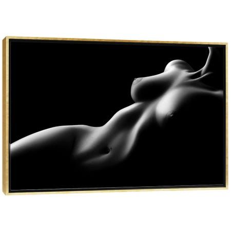 the image is a black and white photograph of a reclining female nude. the lighting is dramatic, using strong contrasts of light and shadow to emphasize the curves and contours of the body. the background is entirely black, focusing all attention on the subject. the overall style is sensual and minimalist, with an emphasis on the form and shape of the human body. the image is presented as a framed canvas print.