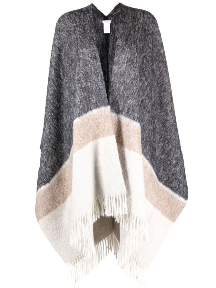 this is a gray, white, and brown striped fringed poncho with a knit texture. the poncho is  folded in half to show its underside, and the fringe is visible around the edges. it is made from wool. the poncho is a comfortable and stylish piece of clothing that can be worn in a variety of settings.