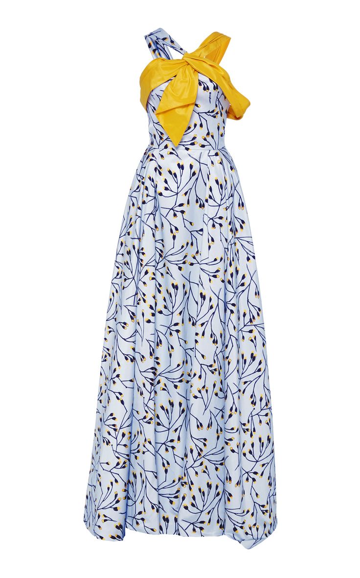 a strapless dress with a floral pattern and a yellow bow at the top.