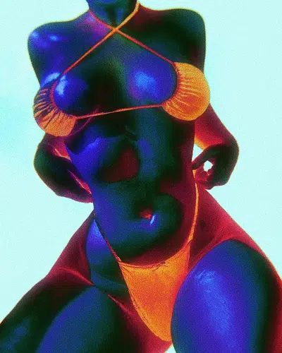 a woman in a bright orange bikini poses for the camera. she is facing forward, with her left leg slightly bent and her right leg straight. her arms are at her sides, her hands are clasped together, and she is looking at the camera with a neutral expression.