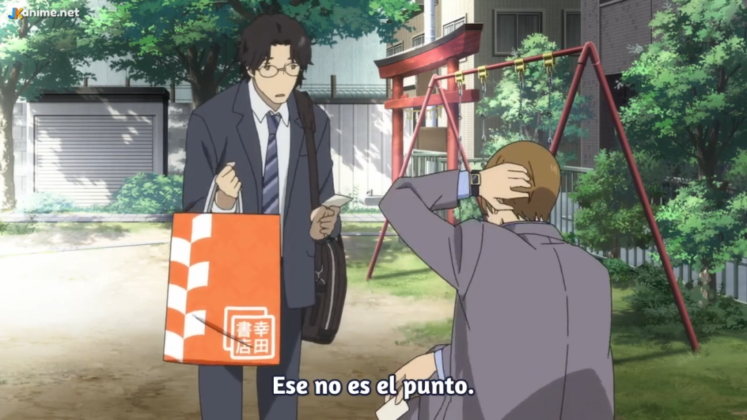 the image shows two men in suits standing in a parklike setting. the man on the left is holding a shopping bag and a small object, possibly a card or a receipt, and appears to be speaking. the man on the right is seated on a swing set, with his hand on his head, as if in frustration or exasperation.  the text at the bottom of the image translates to "that's not the point." the overall atmosphere suggests a tense or serious conversation. the background includes a glimpse of a traditional japanese torii gate and residential buildings, hinting at a typical urban japanese setting. the lighting is soft and natural, likely indicating an overcast day.