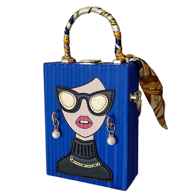 a blue, rectangular handbag features a cartoonstyle image of a woman wearing sunglasses and earrings. the bag has a handle wrapped with a patterned scarf, and another scarf is tied to the handle. the woman in the image is wearing a turtle neck sweater with a gold chain.