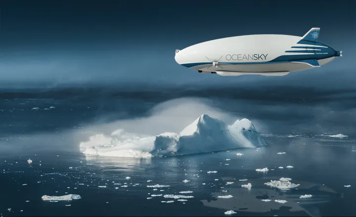 an airship called "ocean sky" flying above an icy landscape. the airship is white with blue accents and has a large inscription "ocean sky" on its side. the icebergs are floating on the dark blue water and are partially covered by a layer of mist or fog. the sky is a dark blue with a few light clouds.