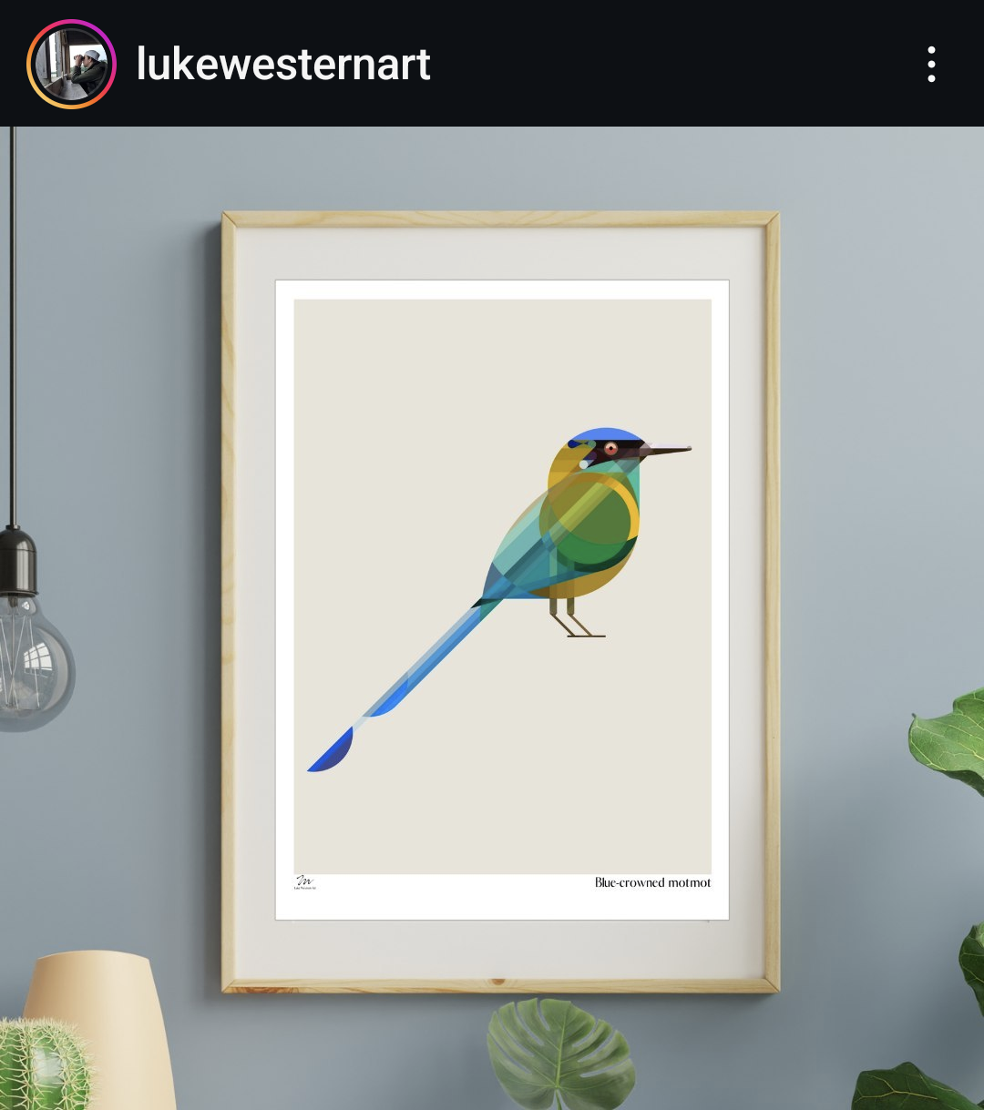 a framed art print featuring a geometric illustration of a bluecrowned motmot bird. the print is hung on a light blue wall and is surrounded by various home decor elements, such as a lamp, a plant, and a light fixture. the print is a simple and stylish way to add a touch of nature to any room.
