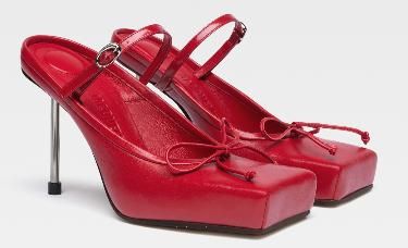 a pair of red leather squaretoe heels with thin straps.  they are elegant and stylish.  the shoes are perfect for a formal occasion.