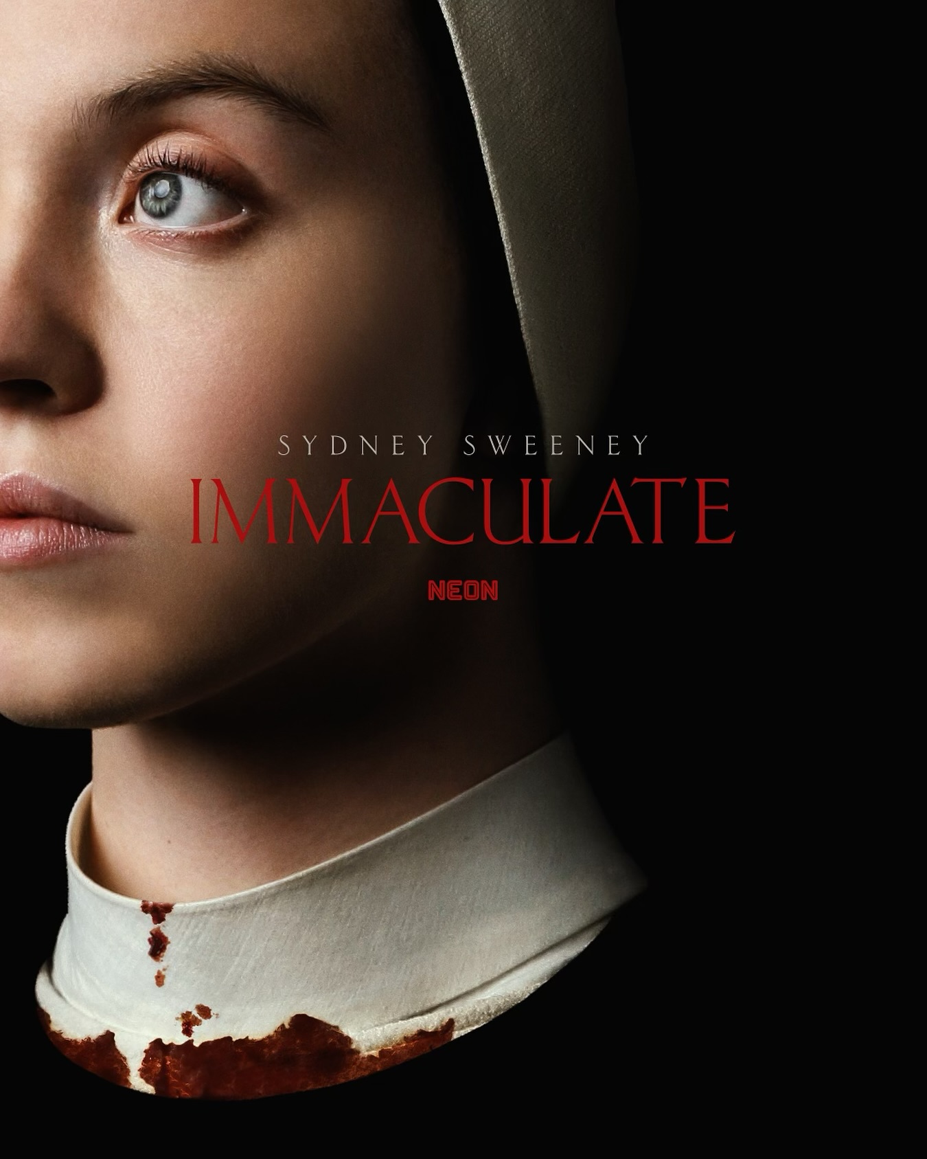 the image is a movie poster for the film "immaculate," starring sydney sweeney.  it features a closeup portrait of sweeney, who appears to be dressed as a nun. her face is partially visible, with her gaze directed off to the side.  the collar of her habit is stained with blood.  the title "immaculate" is prominently displayed in red lettering against a black background. the background is mostly dark, emphasizing the closeup on sweeney's face and the bloodstain. the overall mood is dark, mysterious, and suspenseful.