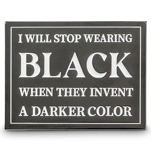 a black rectangular sign with white lettering that reads "i will stop wearing black when they invent a darker color".