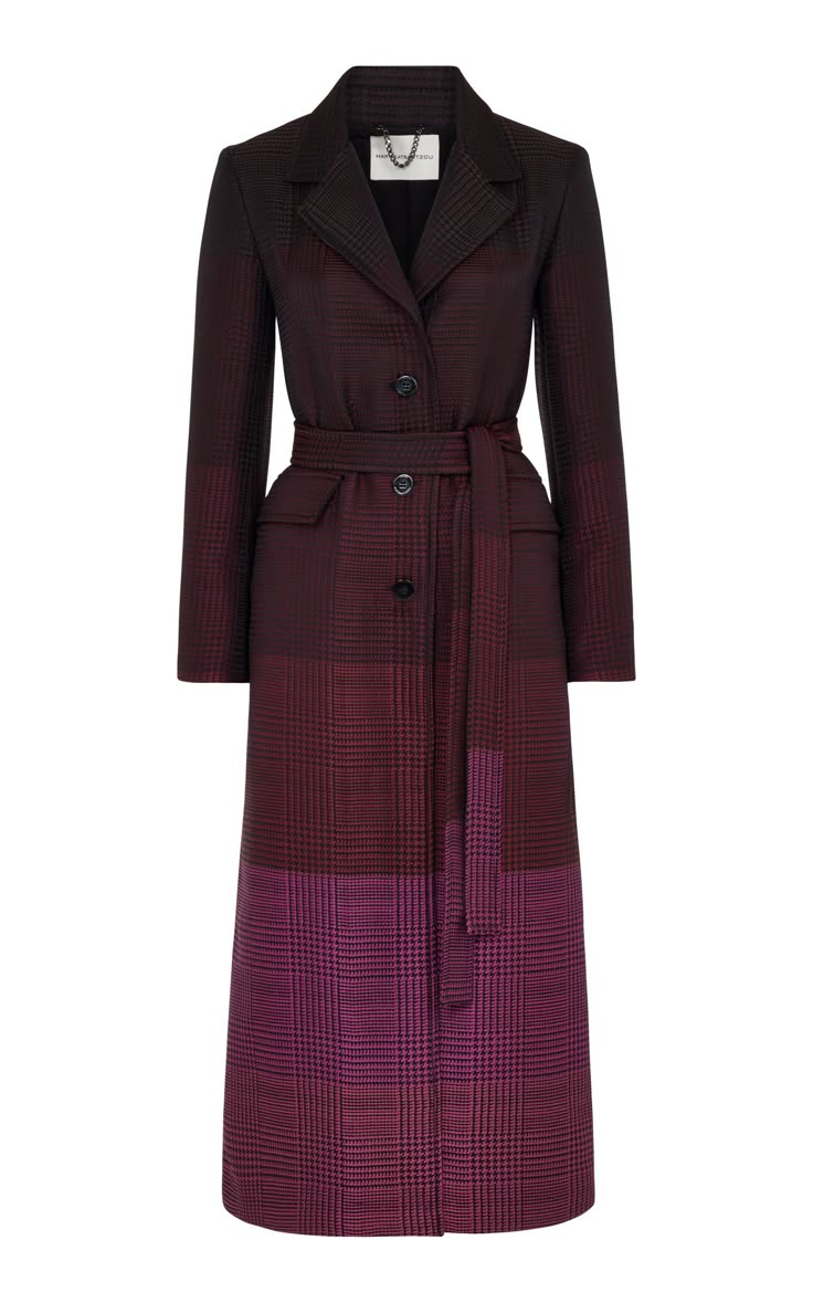 a full shot of a maroon plaid trench coat on a white background. the coat has a belted waist and long sleeves. the bottom half of the coat is darker than the top.