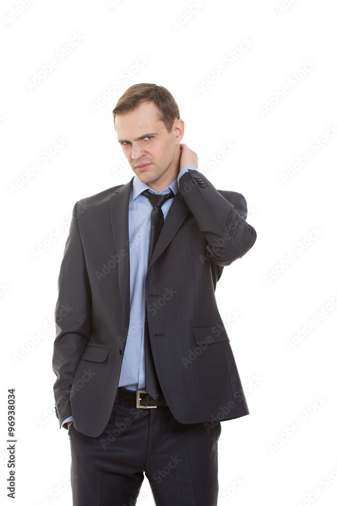 a man wearing a suit and tie is holding the back of his neck and grimacing in pain or discomfort.