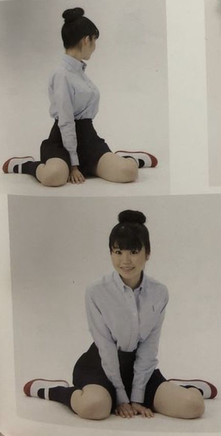 the image shows a woman posing in two different stances. both show the same woman with a bun hairstyle wearing a collared shirt, a skirt, and sneakers, sitting on a neutral surface in what appears to be a studio. in the top image, she's looking away from the camera, while in the bottom one, she is looking and smiling directly at the camera.