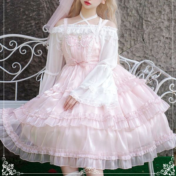 a young woman wearing a pink lolitastyle dress is posed in a garden setting. the dress features delicate lace, ruffles, and an offshoulder design. the overall aesthetic is sweet, feminine, and romantic. the lighting is bright and natural, highlighting the intricate details of the dress and the soft colors of the scene.