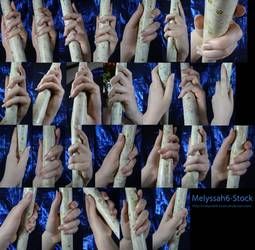 this image shows a compilation of different ways a hand can hold a white stick. hands are in various poses, changing their grip, and making different gestures.  each hand is holding the stick a bit differently.  there are 36 images of hands and a stick in this compilation.