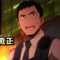 this is a closeup shot of naomasa tsukauchi from my hero academia. he has short, dark hair and dark eyes with a determined expression. he is wearing a black collared shirt with a white undershirt and a dark blue tie. he is also wearing a black tactical vest over his shirt. the background is dark with warm lighting.