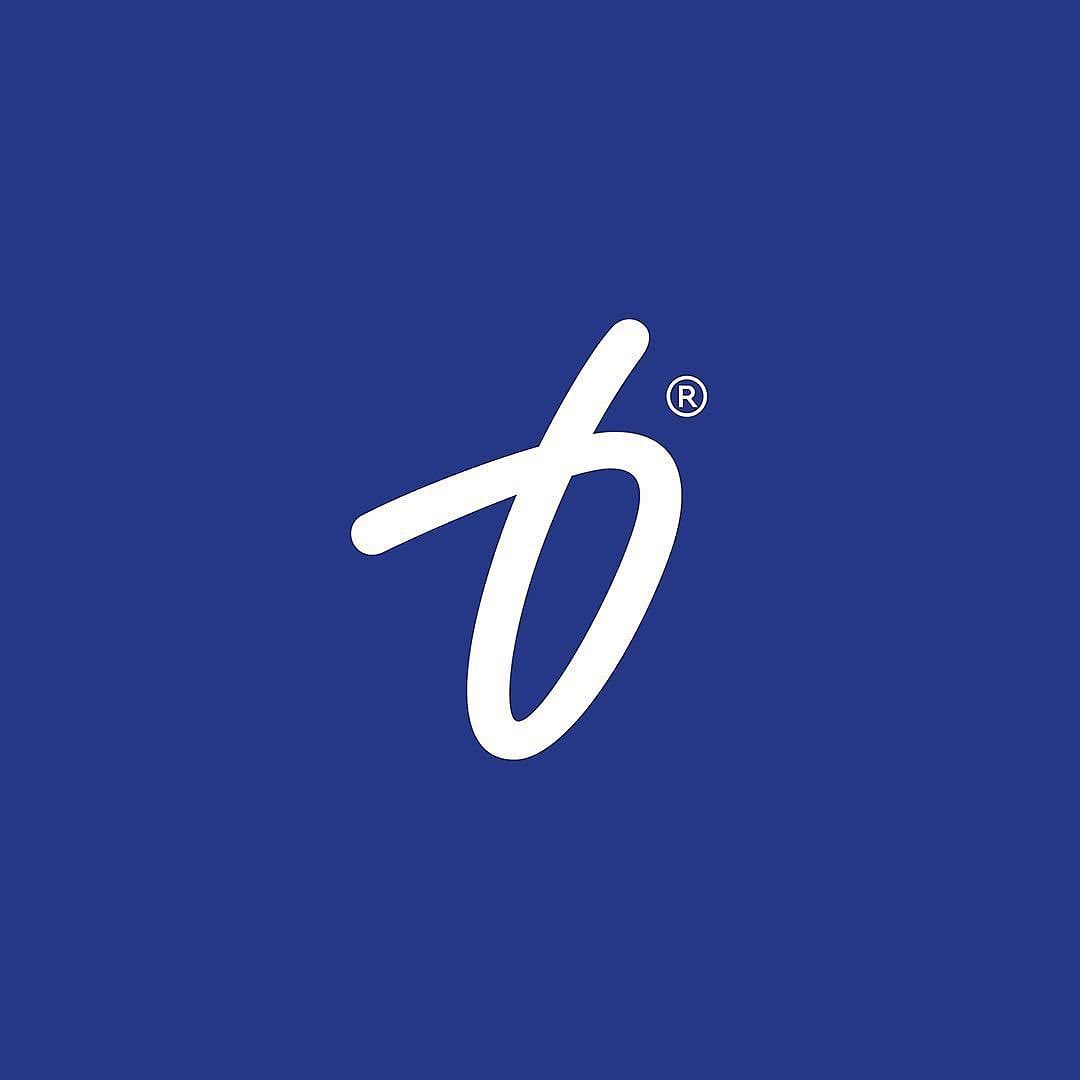 a stylized lowercase "b" in a handwritten script font on a blue background. the "b" is white.  there's a small "r" in a circle (indicating registered trademark) to the upper right of the "b".