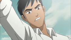 the image shows a young man with a tan complexion and short, dark hair. he is wearing a white, shortsleeved shirt. he is raising his right arm in the air, and his face is contorted in an expression of anger or frustration. his eyebrows are furrowed, his eyes are wide and bloodshot, and his mouth is open as if he is shouting. the background of the image is a blurry, light blue sky. this suggests that the man is outside on a clear day. the overall impression is that the man is very upset about something.