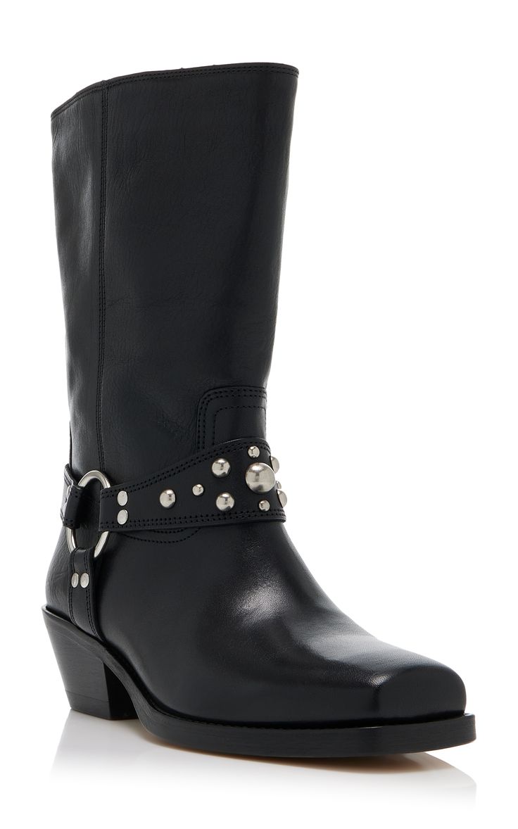 a pair of black leather women's boots with a studded ankle strap. the boots are midcalf height, have a square toe, and a slight heel. they appear to be made of highquality leather and have a sleek, stylish design. the studs on the ankle strap add a touch of edgy detail. the boots are shown against a plain white background.