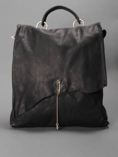 a black leather bag with a flap closure and a top handle. the bag has a silver pin and clasp and a detachable strap. the bag is made of highquality leather and has a sleek and stylish design.