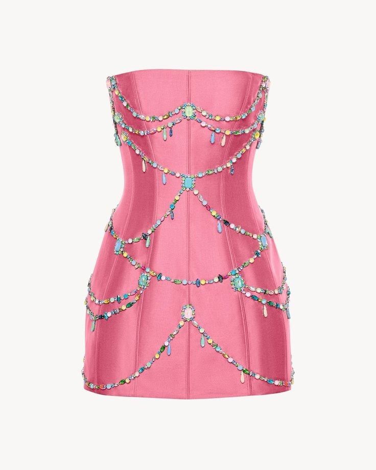 a strapless, pink dress adorned with colorful beaded jewels, is shown against a neutral background.