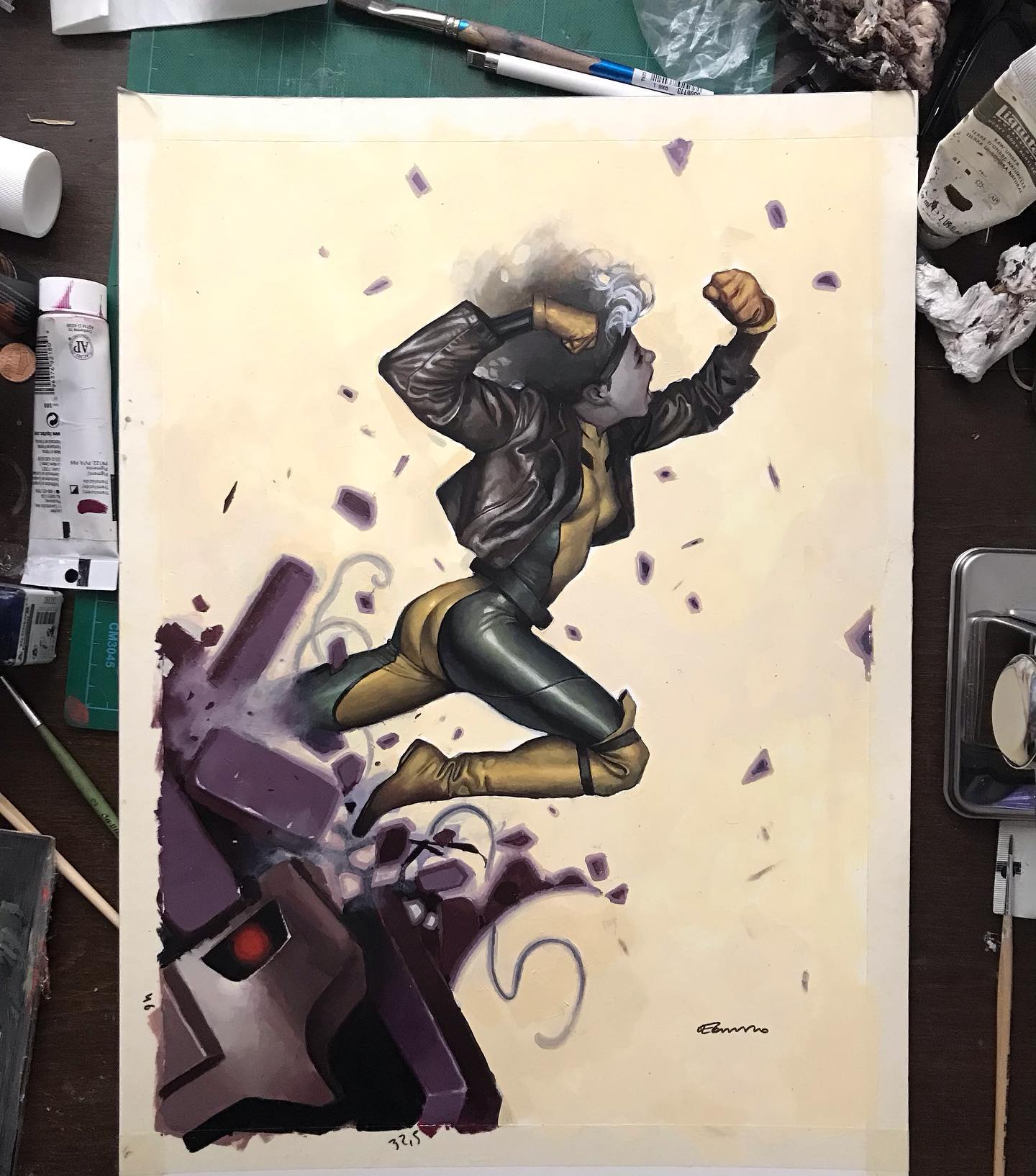 the image shows a handpainted comic book art piece featuring the xmen character rogue punching through a sentinel robot. rogue is depicted in a dynamic action pose, clad in her signature green and yellow suit and leather jacket. she's delivering a powerful punch, shattering the sentinel's head into purple fragments. the artwork is set against a creamcolored background and includes the artist's signature. the art style is traditional, with a focus on detailed shading and textures.