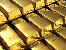 the image showcases a collection of gold bars neatly stacked together. the bars exhibit a gleaming gold surface, reflecting the light from an artificial source. this creates a visually appealing interplay of highlights and shadows, emphasizing the texture and metallic nature of the gold. the perspective is from above, providing a closeup view of the stacked bars and highlighting their intricate arrangement.