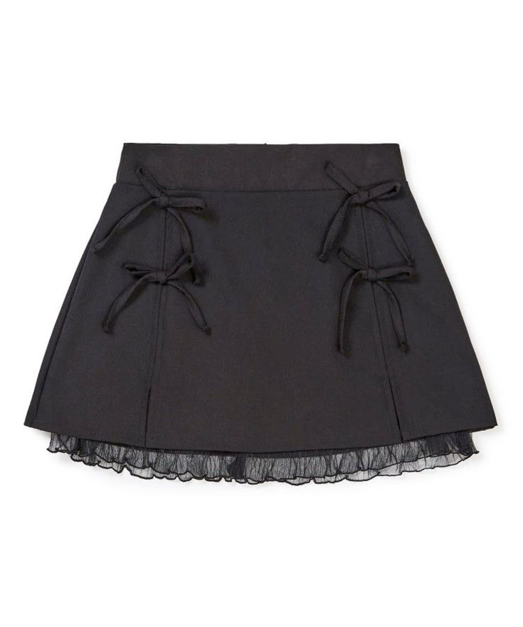 a black skirt with a lace bottom and bow tie details. the skirt is made of a thick fabric and appears to be highwaisted. the lace is a delicate touch, and the bow ties add a touch of whimsy. the skirt is perfect for any occasion, from a casual day out to a special event.