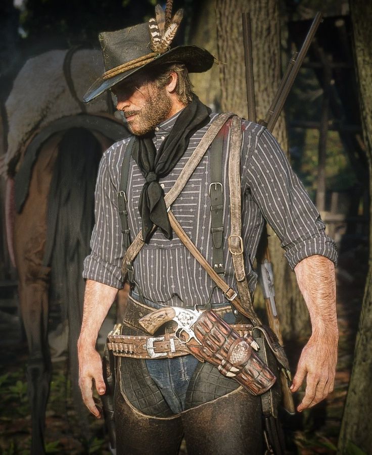 the image is a highly detailed and realistic screenshot from the video game red dead redemption 2. it features arthur morgan, the protagonist, in a contemplative pose. he's dressed in typical western attire: a widebrimmed hat adorned with feathers, a striped shirt, black neckerchief, suspenders, chaps, and a holstered revolver at his hip.  he also carries a rifle across his back.  the setting is a sundappled forest environment. the overall mood is somber and evocative of the game's atmosphere.  the level of detail in the character model and the environment is striking.