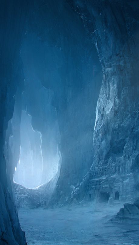 the image shows a large, blue ice cave with snow on the ground. there is an opening at the back of the cave that lets in light. the walls of the cave are made of stone and ice, and there are architectural carvings on one side. the overall atmosphere is cold and serene, suggesting a frozen landscape.