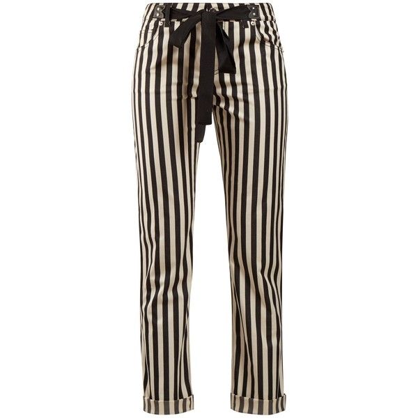 a pair of highwaisted black and white striped pants is shown. the pants have a black belt tied at the waist and the hem is rolled. the pants are straightlegged and made of a smooth, slightly shiny material.