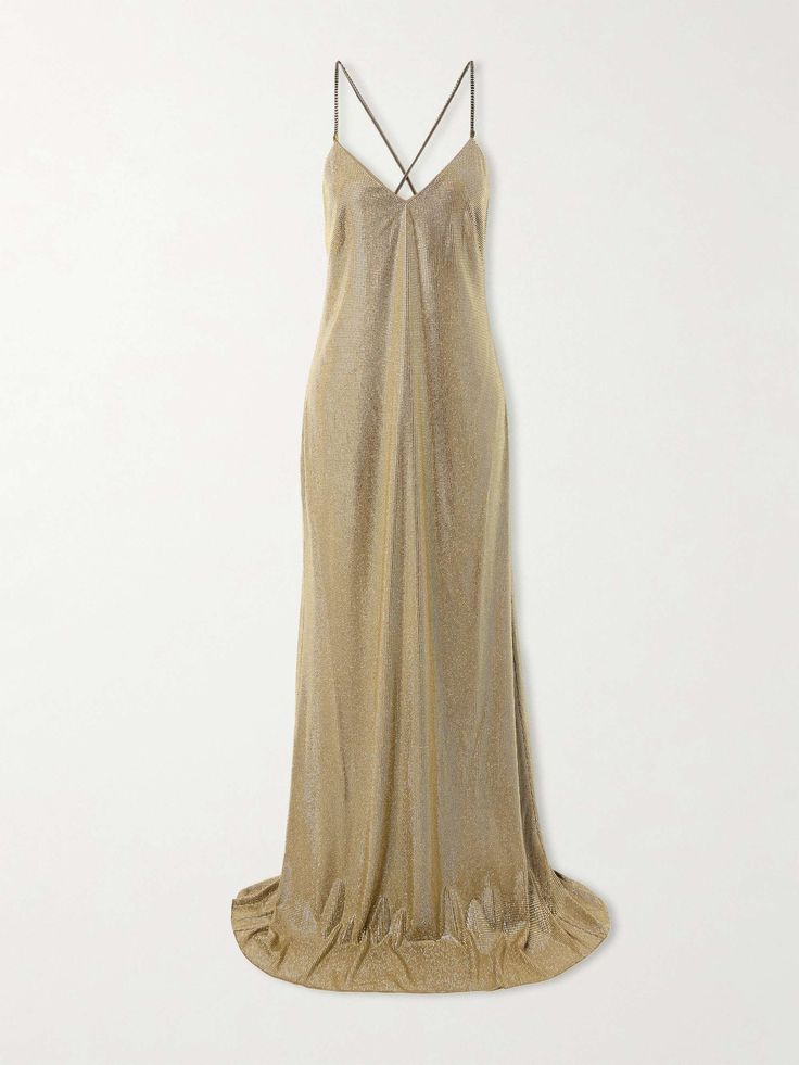 a gold slip dress with a low vneckline and spaghetti straps. the dress is made of a shimmering, sparkly fabric and has a long, flowing silhouette. it is shown on a white background and appears to be photographed in a studio.