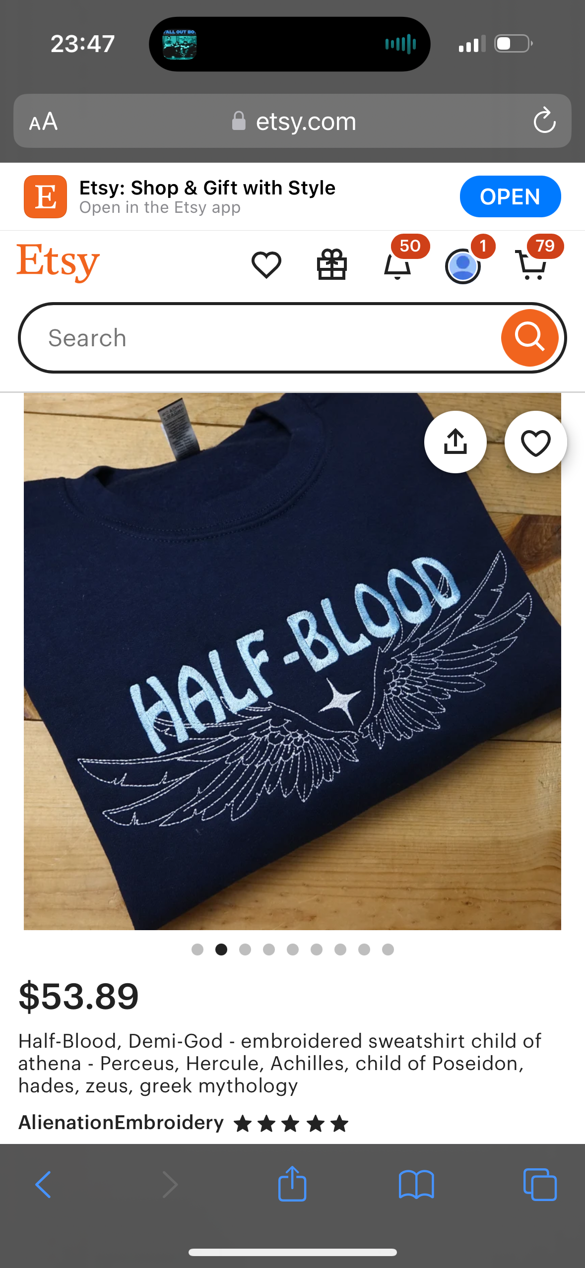 this image is a product listing for an embroidered sweatshirt on the website etsy.com. it is navy blue with the words "halfblood" embroidered in white on the front with stylized wings. the listing description is for a child of athena perceus, hercule, achilles, poseidon, hades, and zeus, and the sweatshirt is described as greek mythology, camp halfblood, rick riordan, percy jackson, greek god, hero, mythical, legendary, winged.  the image is a closeup of the sweatshirt with the website's logo and some of the website's navigation in the background.