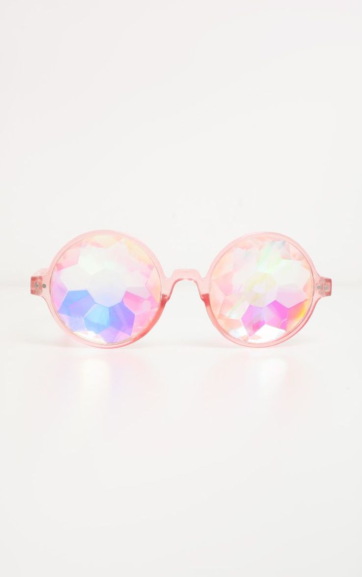 a pair of pink sunglasses with kaleidoscopic lenses on a white background.