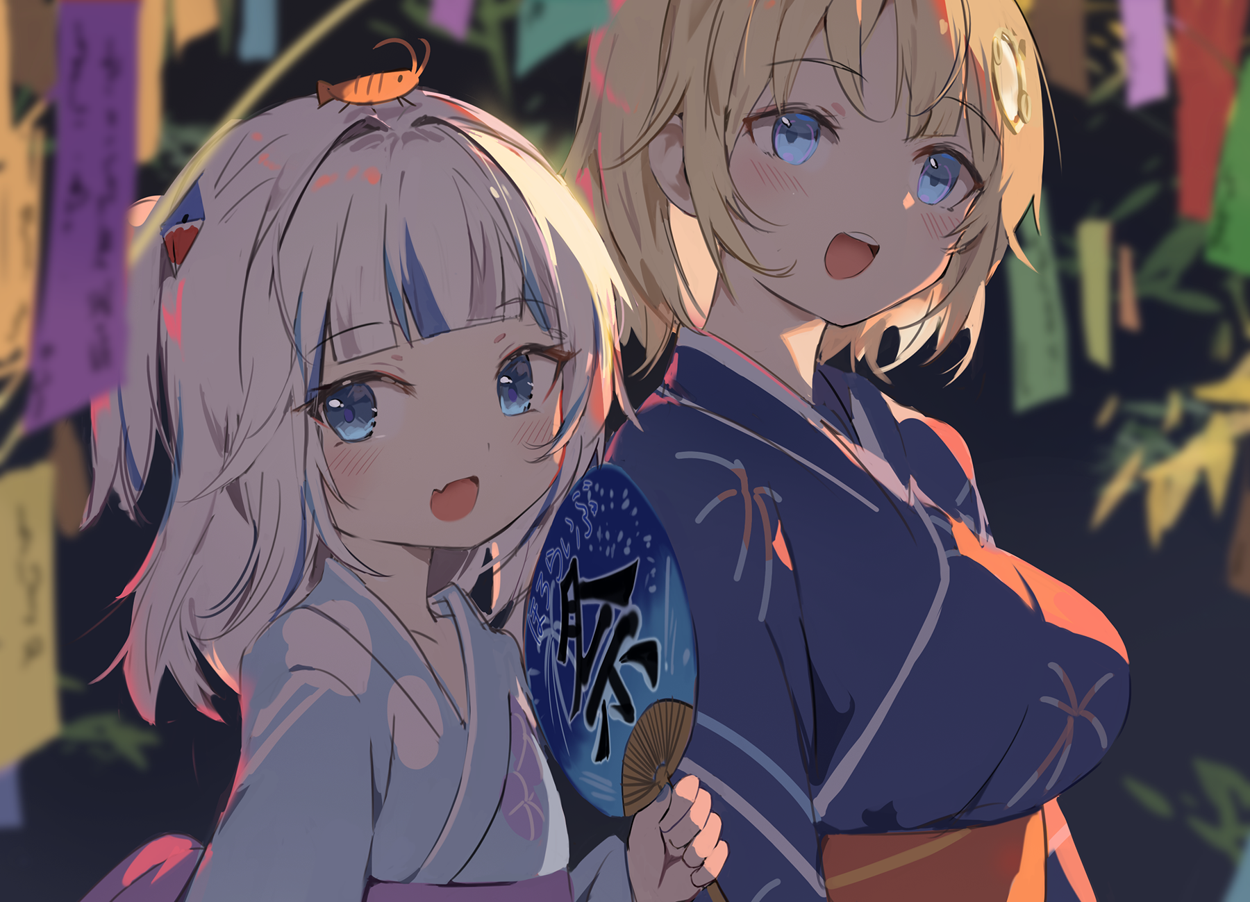 the image is a digital artwork depicting two anime girls dressed in yukatas, traditional japanese summer garments. they are standing close together, possibly at a summer festival, with tanabata decorations (paper streamers) in the background. one girl has blonde hair and blue eyes, while the other has white/pale lilac hair with blue eyes. the blonde girl has a slight blush on her cheeks. the girl with white hair is holding a hand fan decorated with japanese characters. the overall style is cute and kawaii, with soft colors and a focus on the characters' expressions. the background is slightly blurred, focusing attention on the two girls in the foreground.