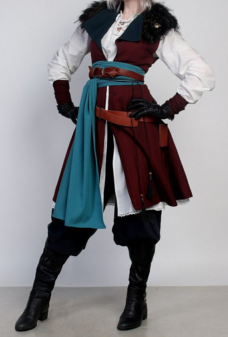 full body shot of a woman in a meticulously crafted fantasy costume. the outfit consists of a maroon vest over a white blouse, dark pants tucked into tall black boots, and a teal scarf draped around the waist.  the vest is detailed with brown leather belts and has a furtrimmed collar.  black gloves and boots complete the look.  the backdrop is a simple gray, allowing the costume to be the focus. the woman's pose is confident and stylish. the overall impression is of a character from a fantasy novel or game.