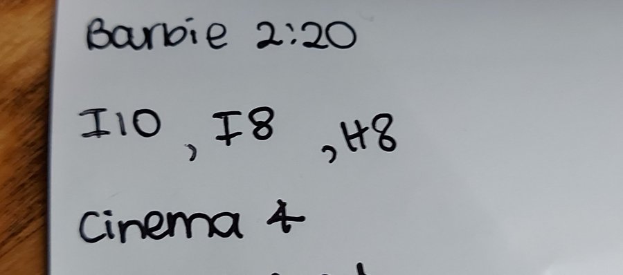 a handwritten note with "barbie 2:20", "i10, i8, h8", and "cinema 4" written on a white surface.