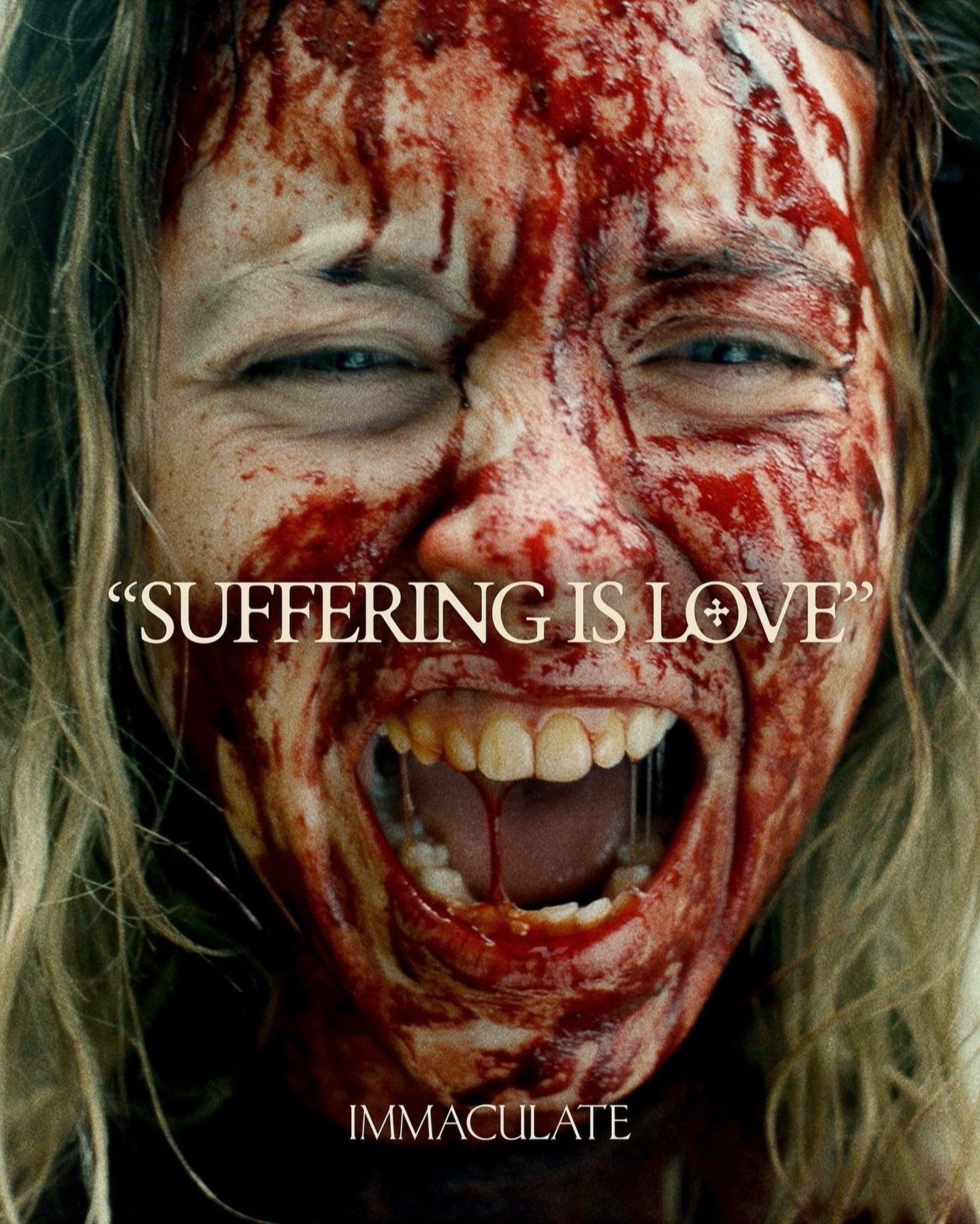 the image is a movie poster for a horror film titled "immaculate".  the poster features a closeup of a woman's face, severely injured and covered in blood. her mouth is open in a scream, revealing her teeth. blood streams down her face and is smeared across her skin.  the tagline "suffering is love" is prominently displayed in a stark font over the image, creating a jarring juxtaposition. the overall effect is one of intense violence and psychological horror. the lighting and color palette enhance the macabre atmosphere.
