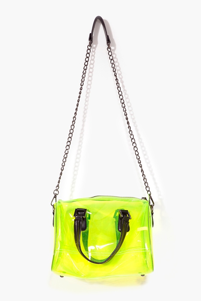 a neon green transparent handbag hangs from a black chain strap against a white background. the bag has black handles.