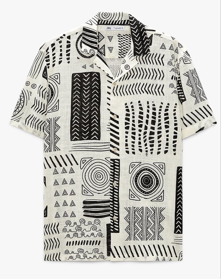 the image shows a shortsleeved shirt with a black and white patterned print. the shirt has a collar and is made of a textured fabric. the print consists of geometric shapes and patterns in black on a white background.