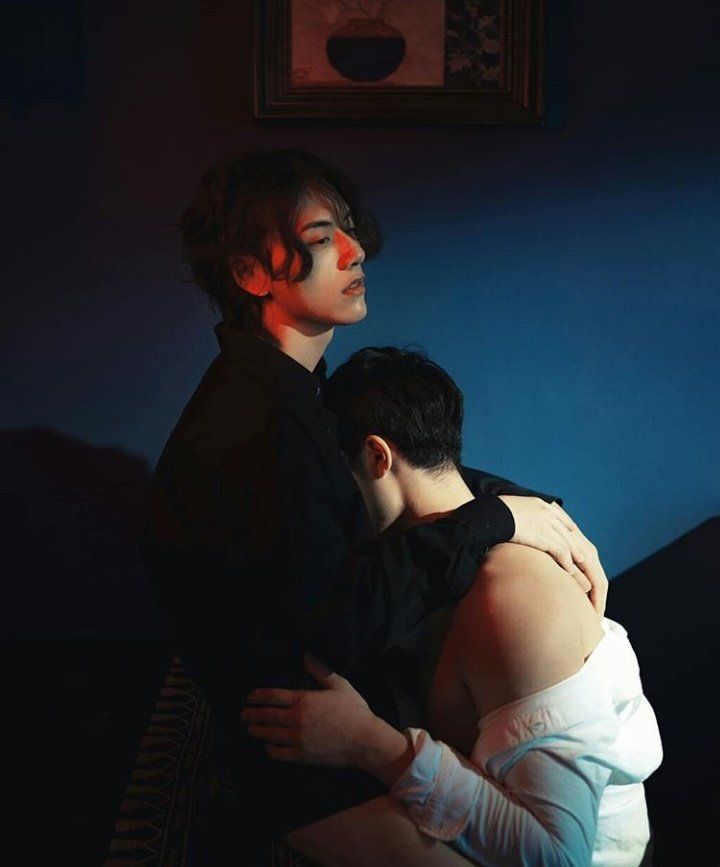 two men are hugging
